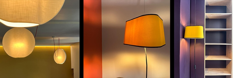 Luminaires en tissu : suspensions boules, lampe orange à liseré et applique jaune dans les chambres